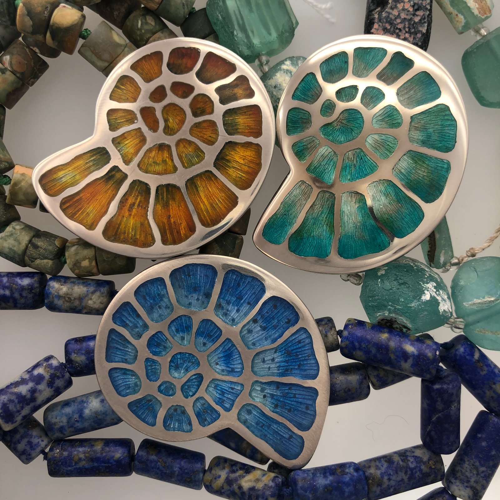 Champlevé enamel silver Ammonite Fossil pendants with engraved textured background